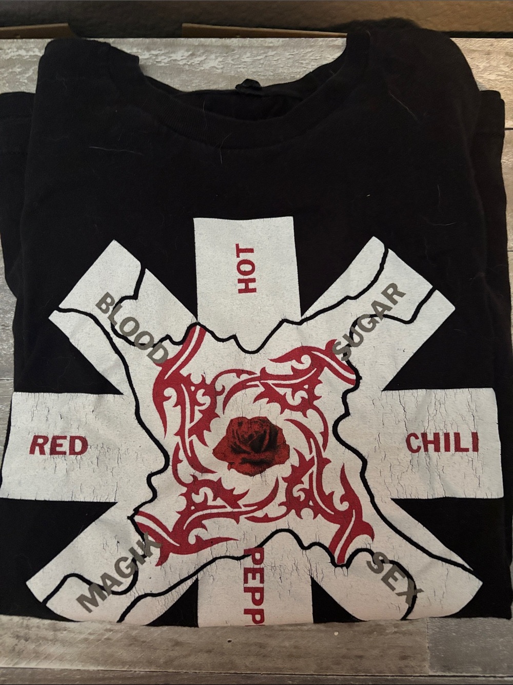 Black Graphic Tee with Red Rose & White Starburst Design
